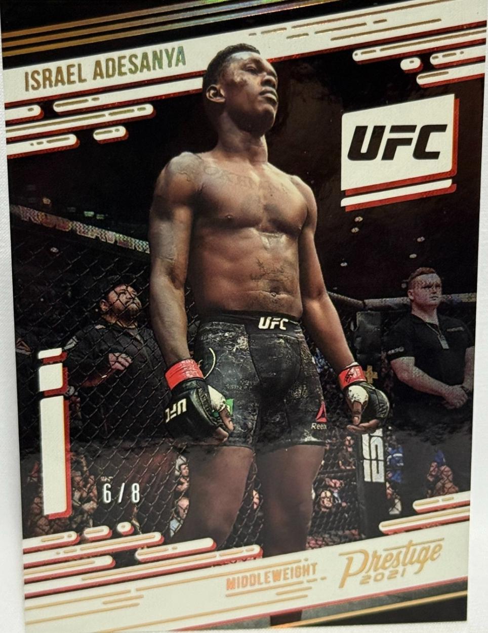 Israel Adesanya 2021 Panini Chronicles UFC Base Prestige #71 Asia Gold
