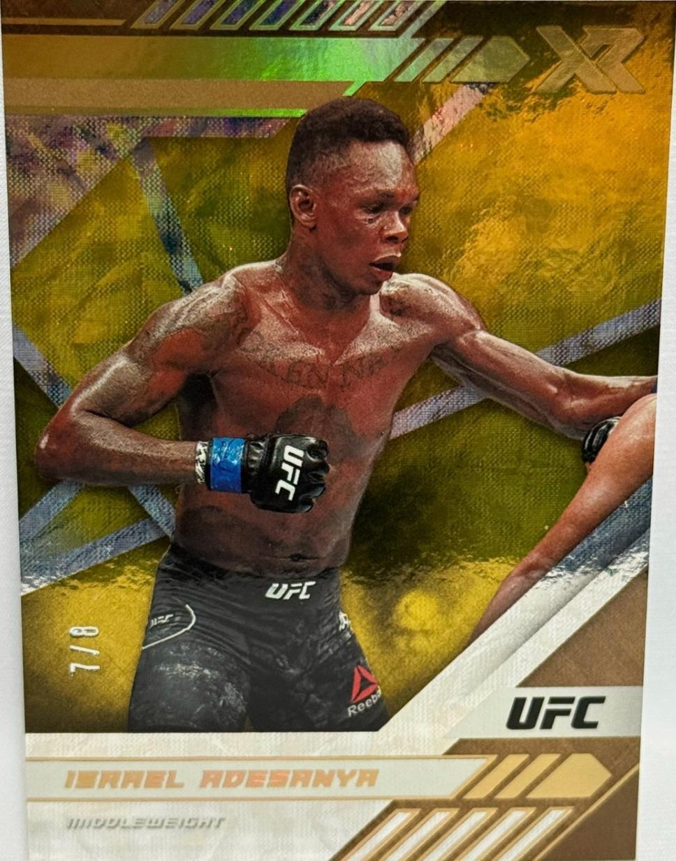 Israel Adesanya 2021 Panini Chronicles UFC Base XR #195 Asia Gold