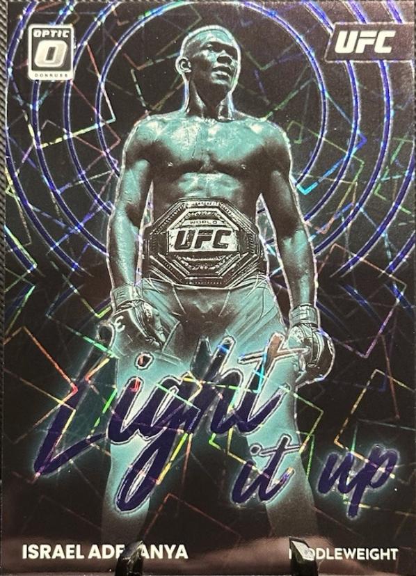 Israel Adesanya 2023 Panini Donruss Optic UFC Light It Up #17 Purple Velocity