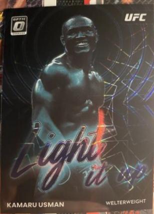 Kamaru Usman 2023 Panini Donruss Optic UFC Light It Up #12 Purple Velocity