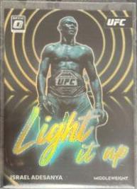 Israel Adesanya 2023 Panini Donruss Optic UFC Light It Up #17 Gold