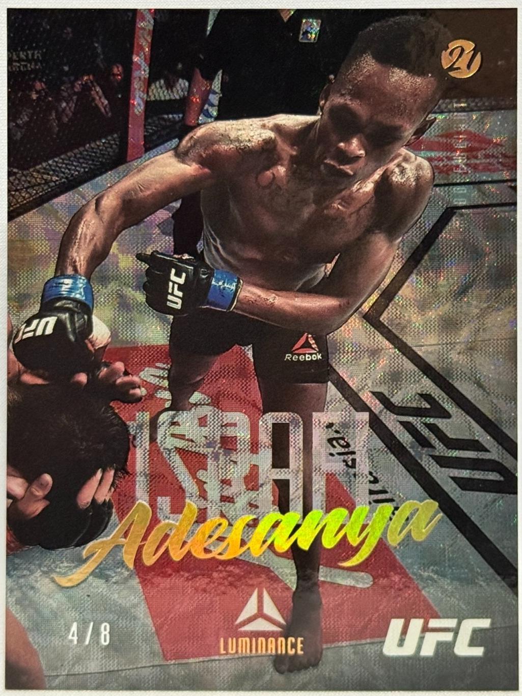 Israel Adesanya 2021 Panini Chronicles UFC Base Luminance #60 Asia Gold
