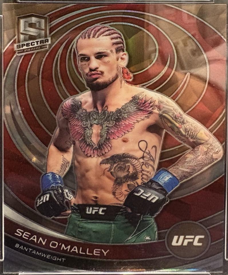 Sean O'Malley 2023 Panini Chronicles UFC Base Spectra #382 Bronze