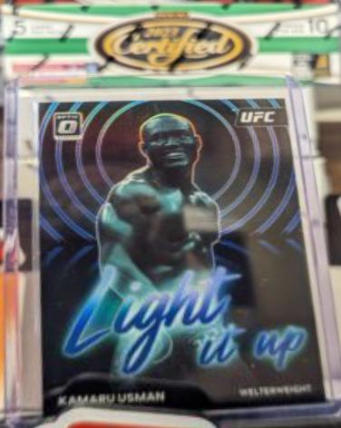 Kamaru Usman 2023 Panini Donruss Optic UFC Light It Up #12 Blue